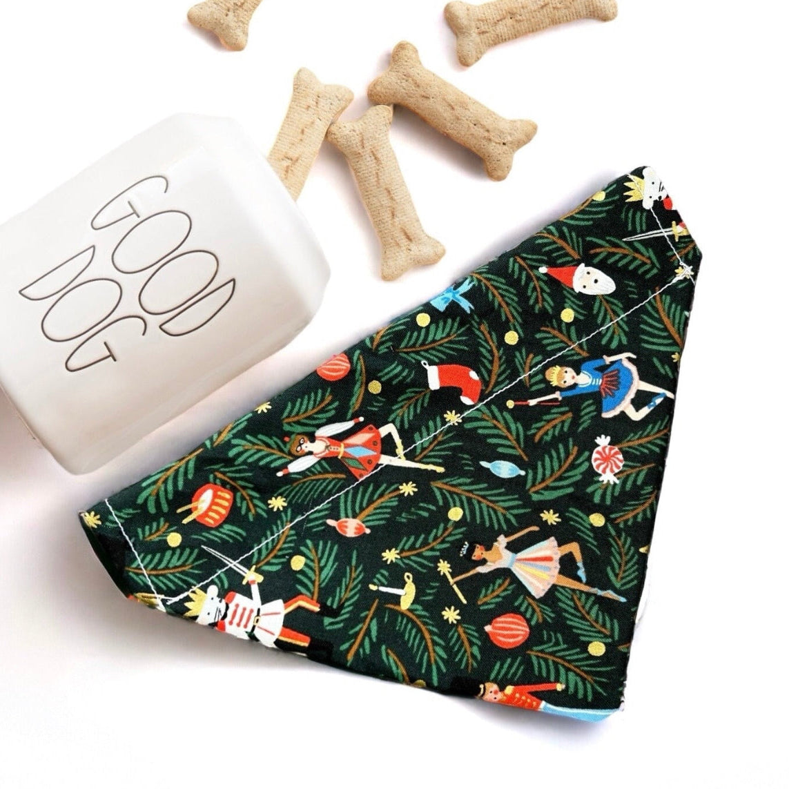 a dog bandana next to a dog bone bone