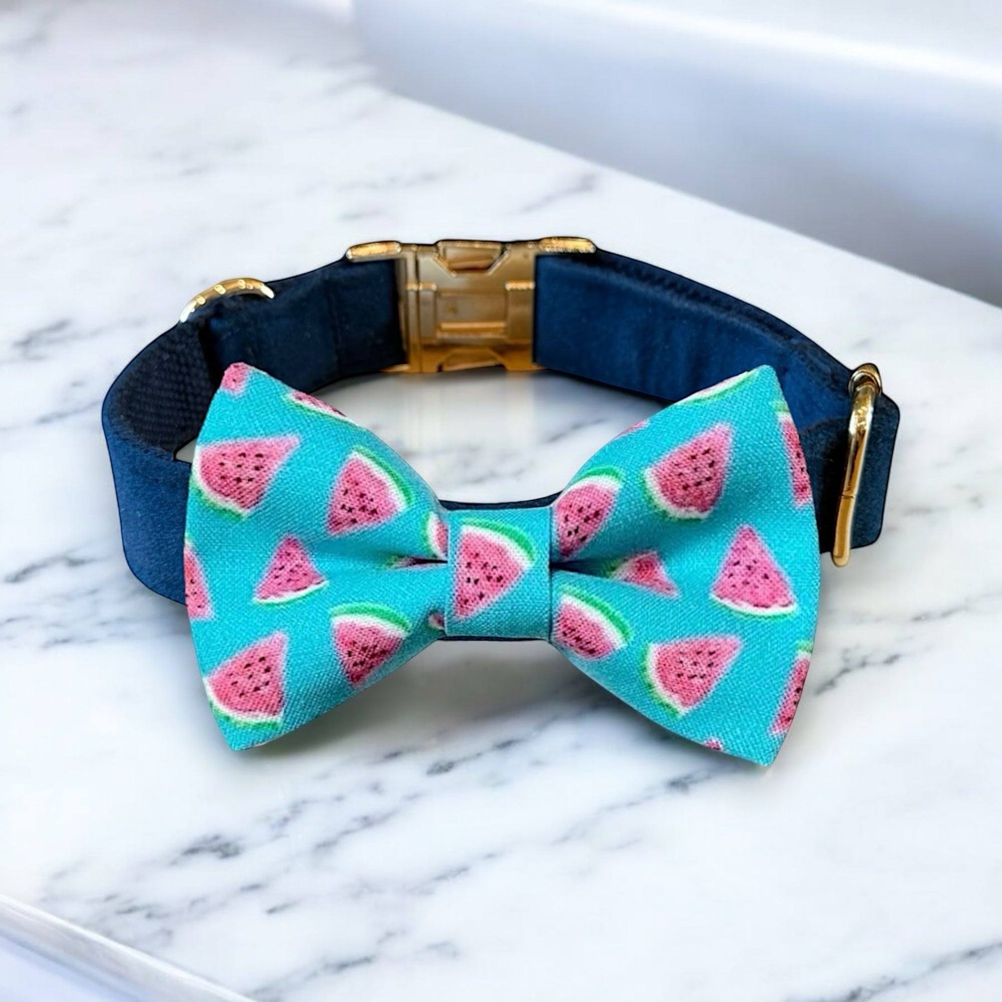 Dog collar with watermelon pattern bow tie on a marble surface