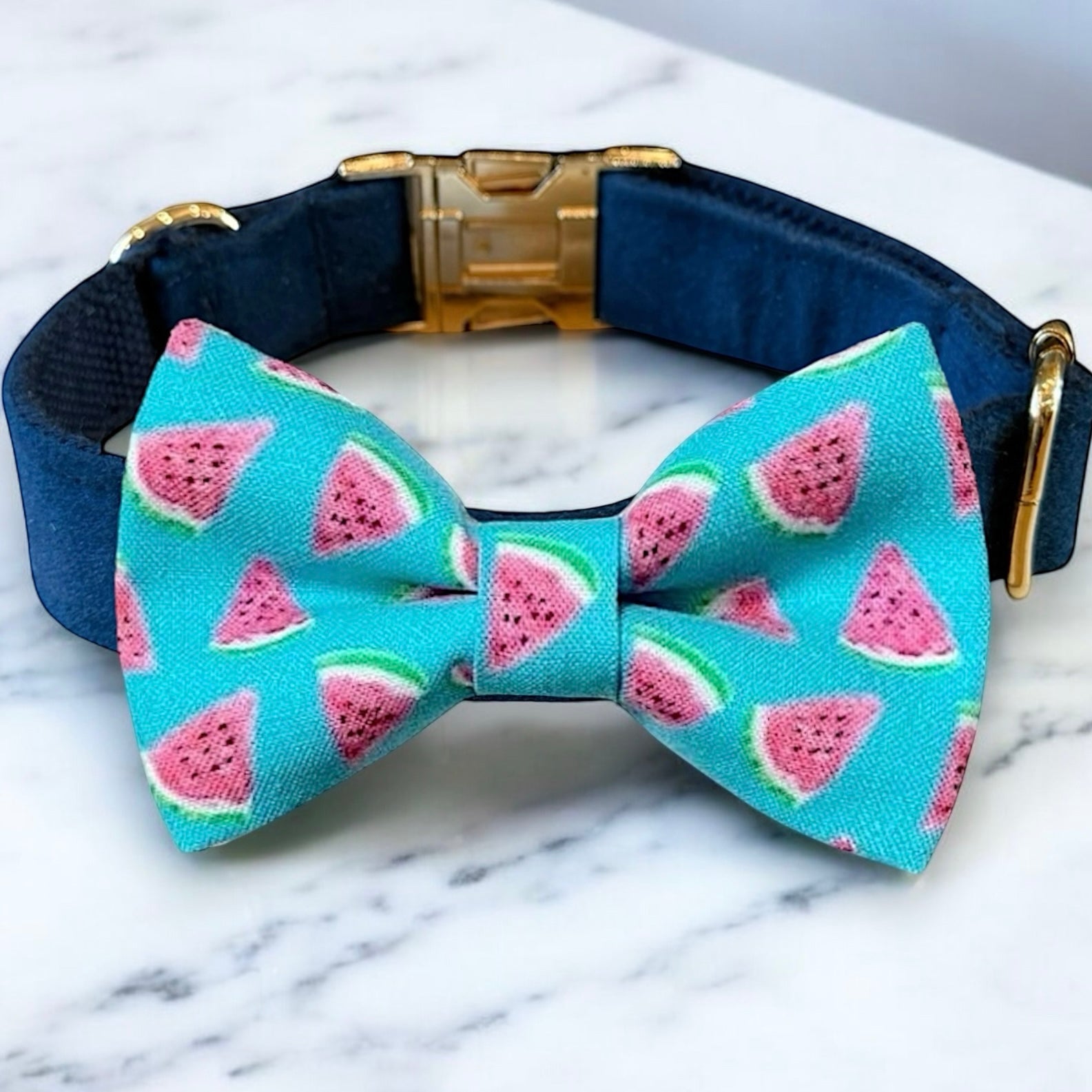 Dog collar with watermelon pattern bow tie on a marble surface