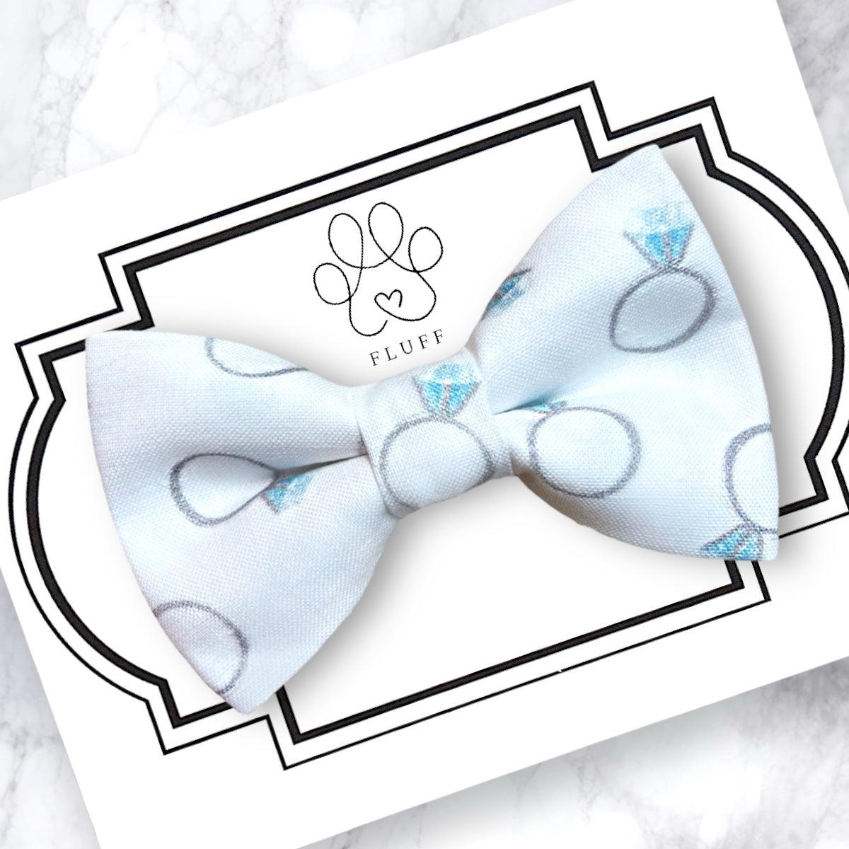 Engagement Ring on White Dog Bow Tie and Cat Bow Tie