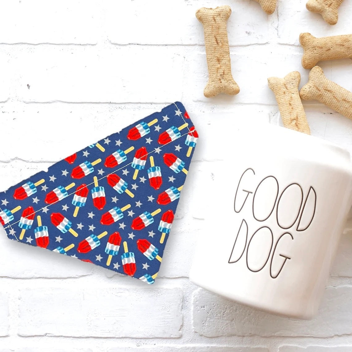 a cup of coffee next to some dog treats
