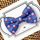 a blue bow tie with red, white and blue cupcakes on it